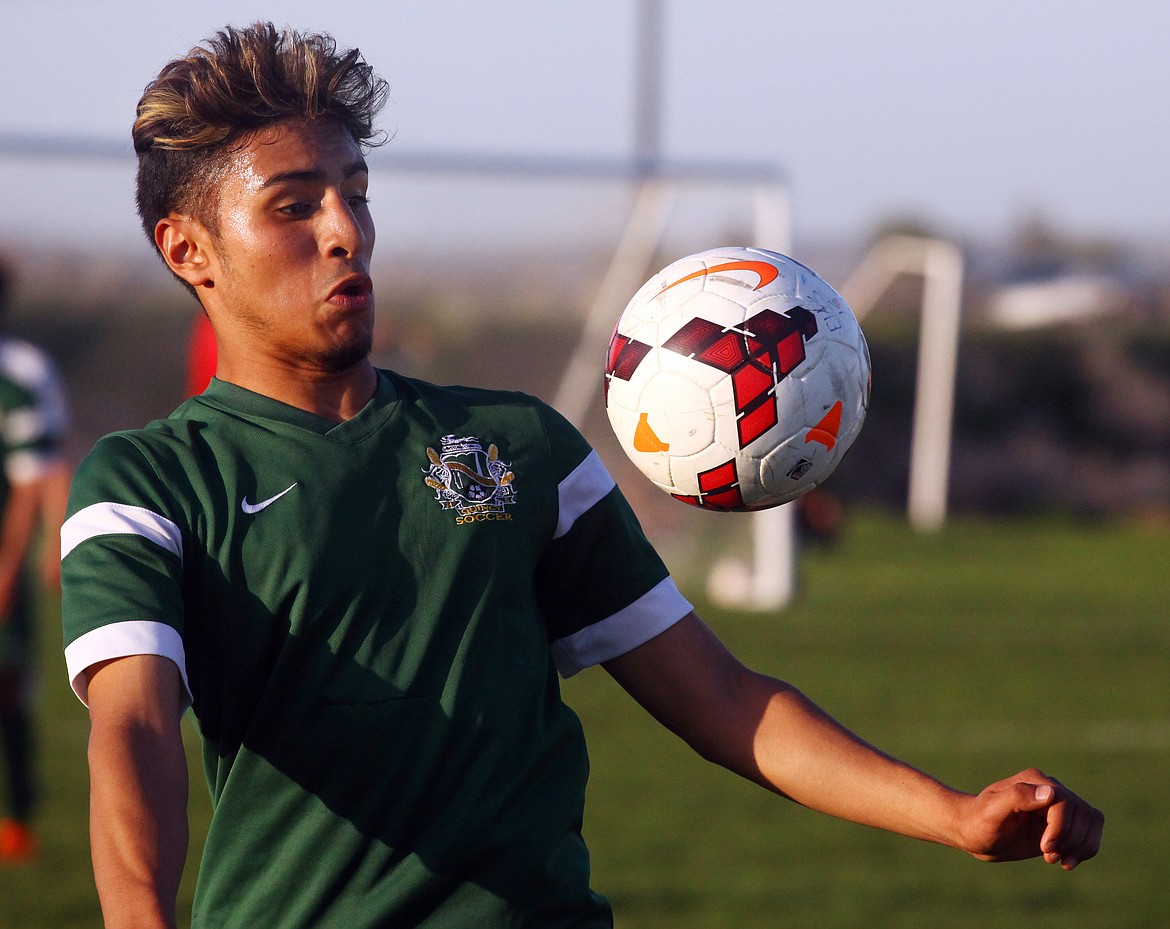 Rodney Harwood/Columbia Basin HeraldQuincy midfielder Arturo Aramburo controls the ball on a throw-in during the first half of Tuesday's CWAC match at Ephrata.