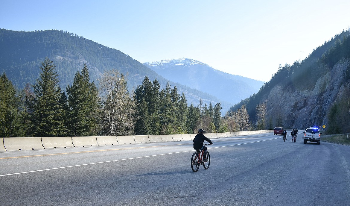 Though the riders eventually had to load their bikes onto vehicles due to time constraints, the Special Olympic Torch was accompanied by law enforcement and community members on bicycle from Troy to Libby on Wednesday. (Ben Kibbey/The Western News)