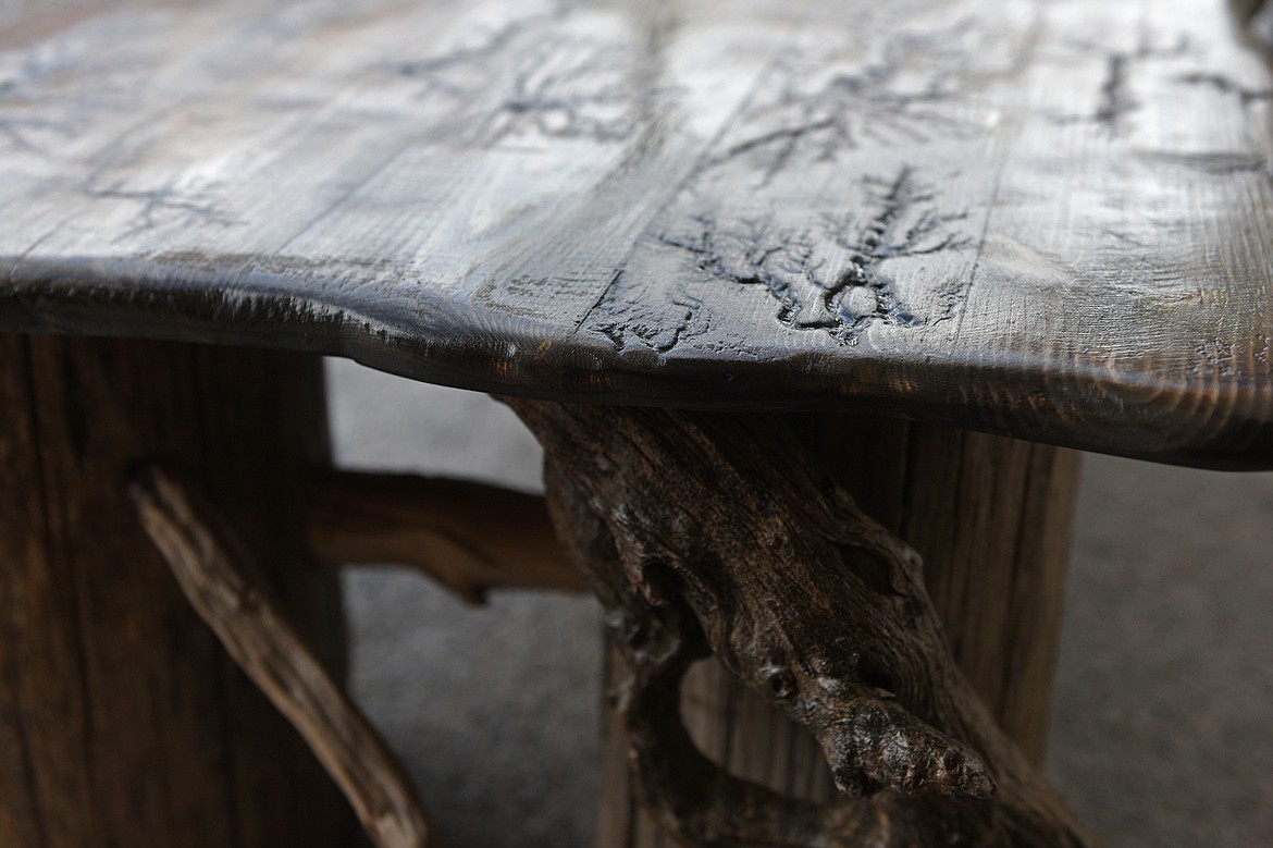 Detail of a handmade table crafted from reclaimed driftwood by carpenter Tom White at the pop-up shop Seasons in downtown Kalispell on Wednesday, April 11. (Casey Kreider/Daily Inter Lake)