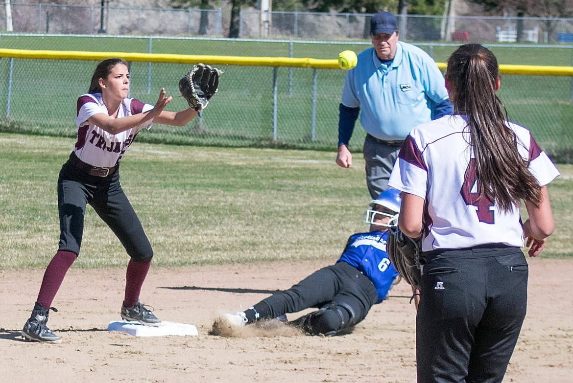 Troy&#146;s Talise Becquart gets a good catch at second, but Mission&#146;s player was called safe on her slide April 20. (Ben Kibbey/The Western News)