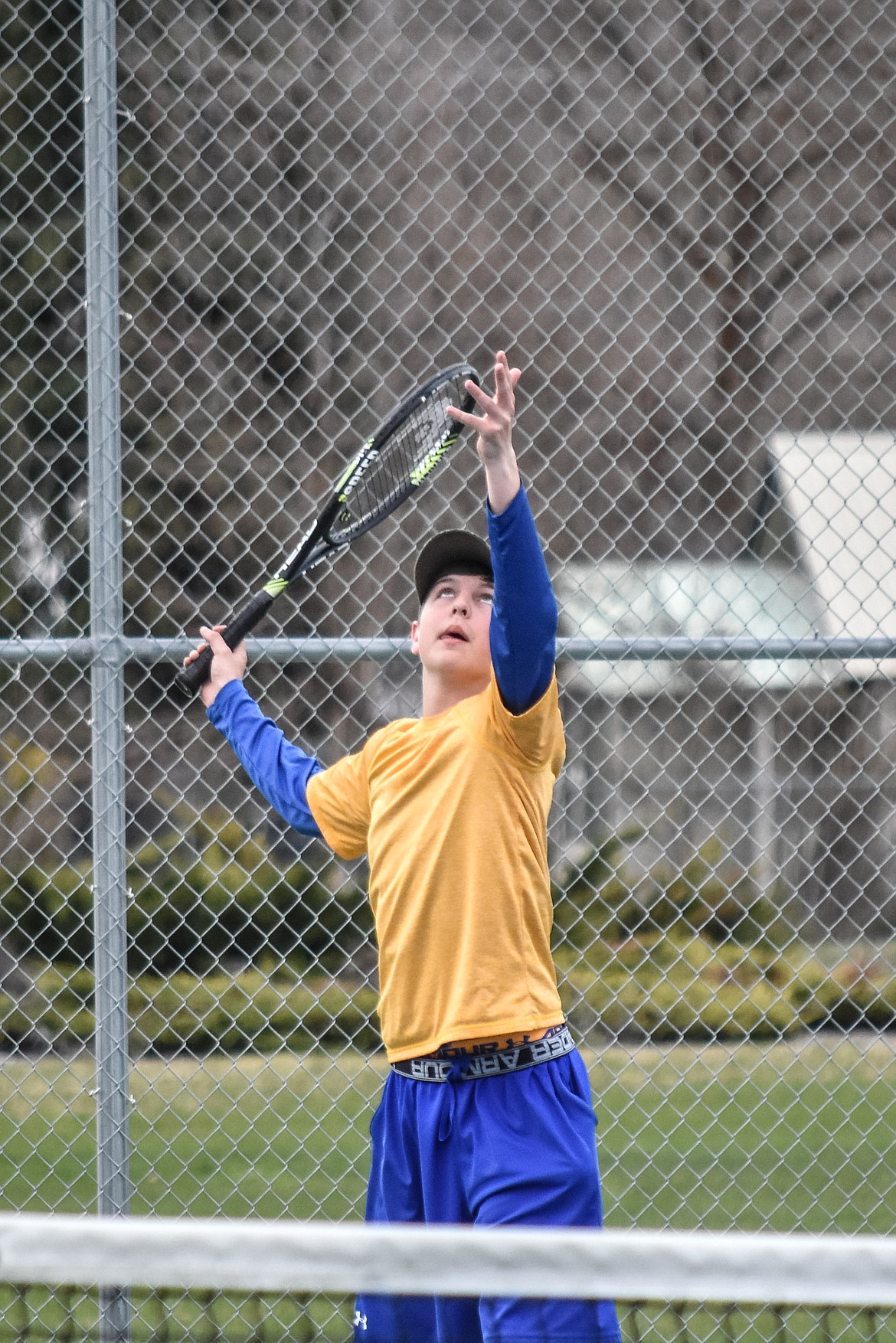 Libby&#146;s Colton Halvorson sets up a serve during the second consolation round with doubles partner Cayman Lee at the Libby Invitational, April 21. (Ben Kibbey/The Western News)