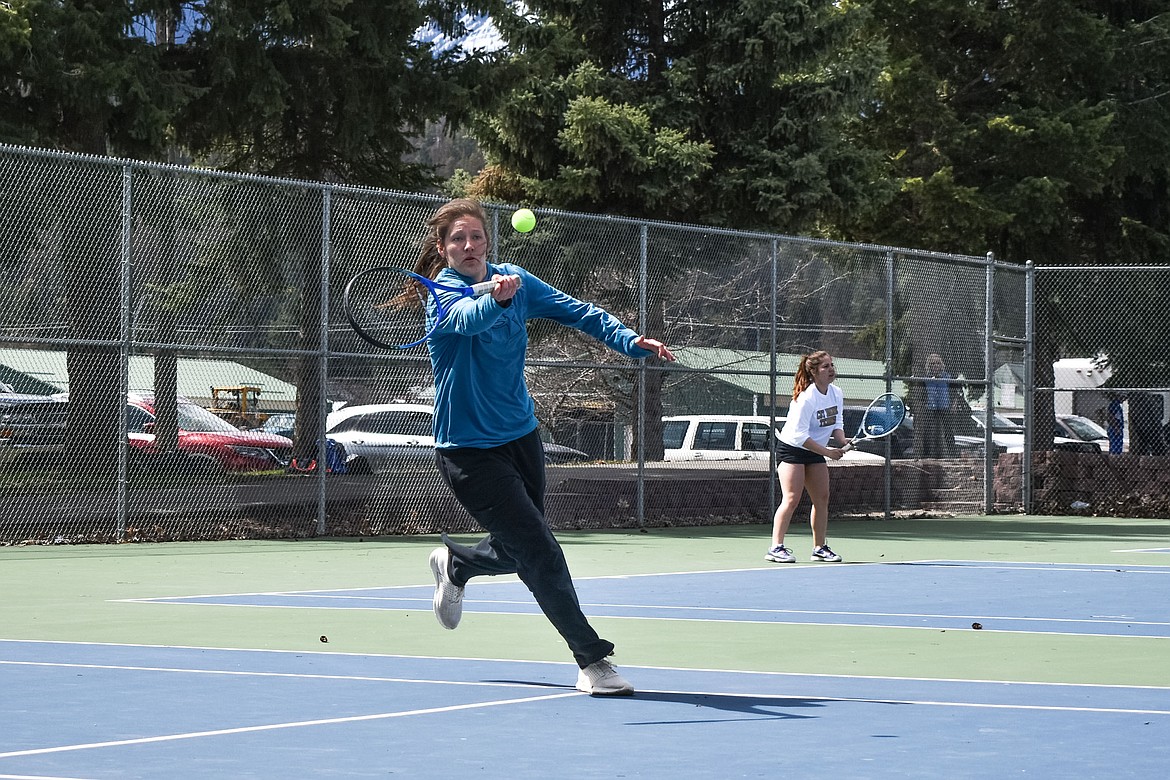 Troy&#146;s Allie Coldwell makes a return while playing with her doubles partner, Kaitlyn Downey against Cassidy Norick and Kelsey Wright of Columbia Falls, at the Libby Invitational, April 21. (Ben Kibbey/The Western News)