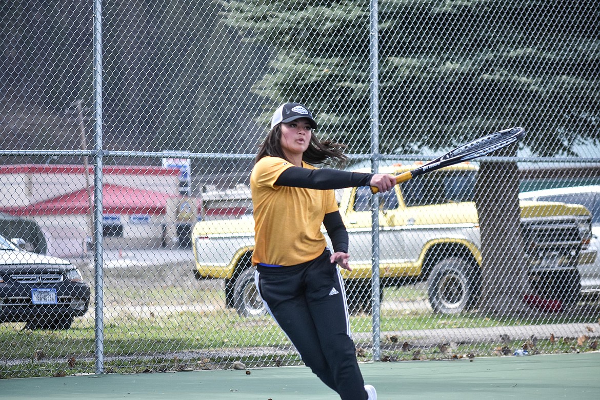 Libby&#146;s Abigail Creighton leans into her shot in her first match of the Libby Invitational, April 21, facing Bigfork&#146;s Ellie Berreth. (Ben Kibbey/The Western News)