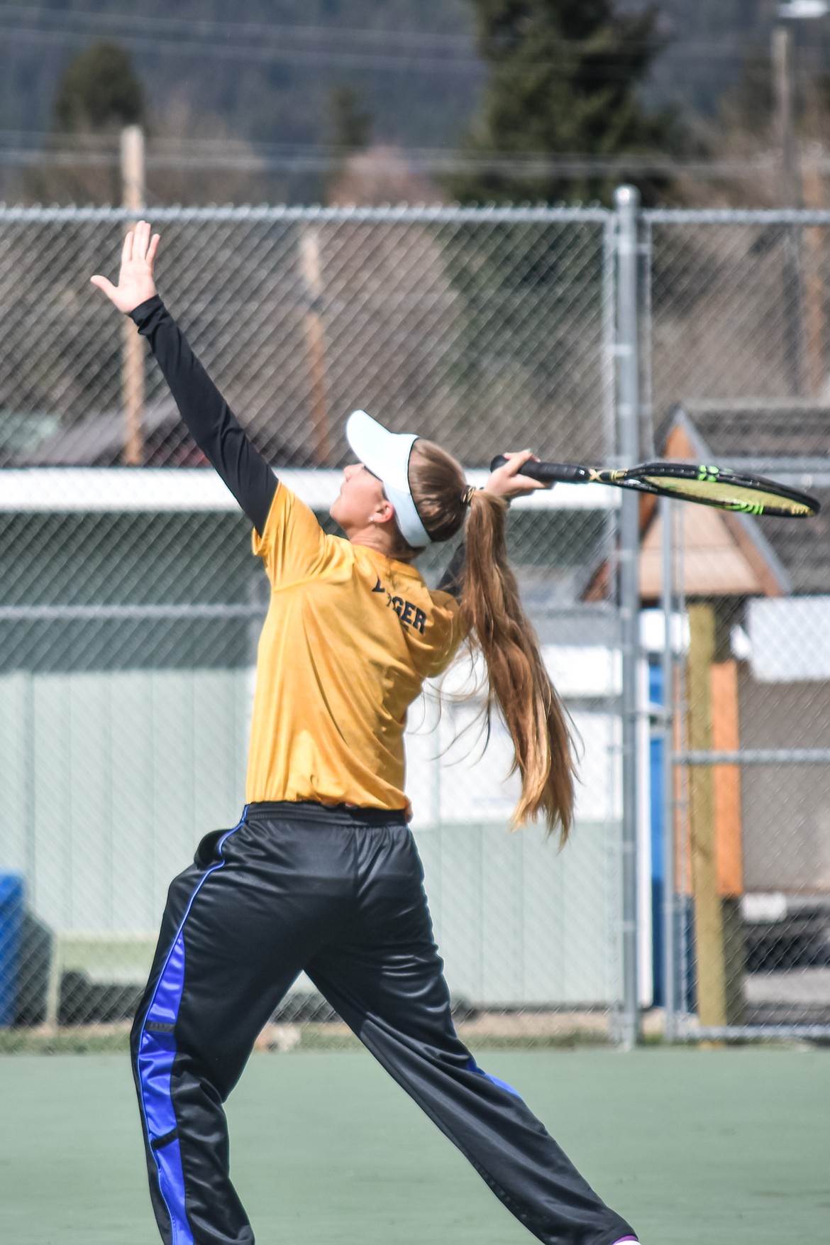 Libby&#146;s Isabelle Martineau sets up a serve during her first match against Clark Fork&#146;s Madison Courser at the Libby Invitational, April 21. (Ben Kibbey/The Western News)