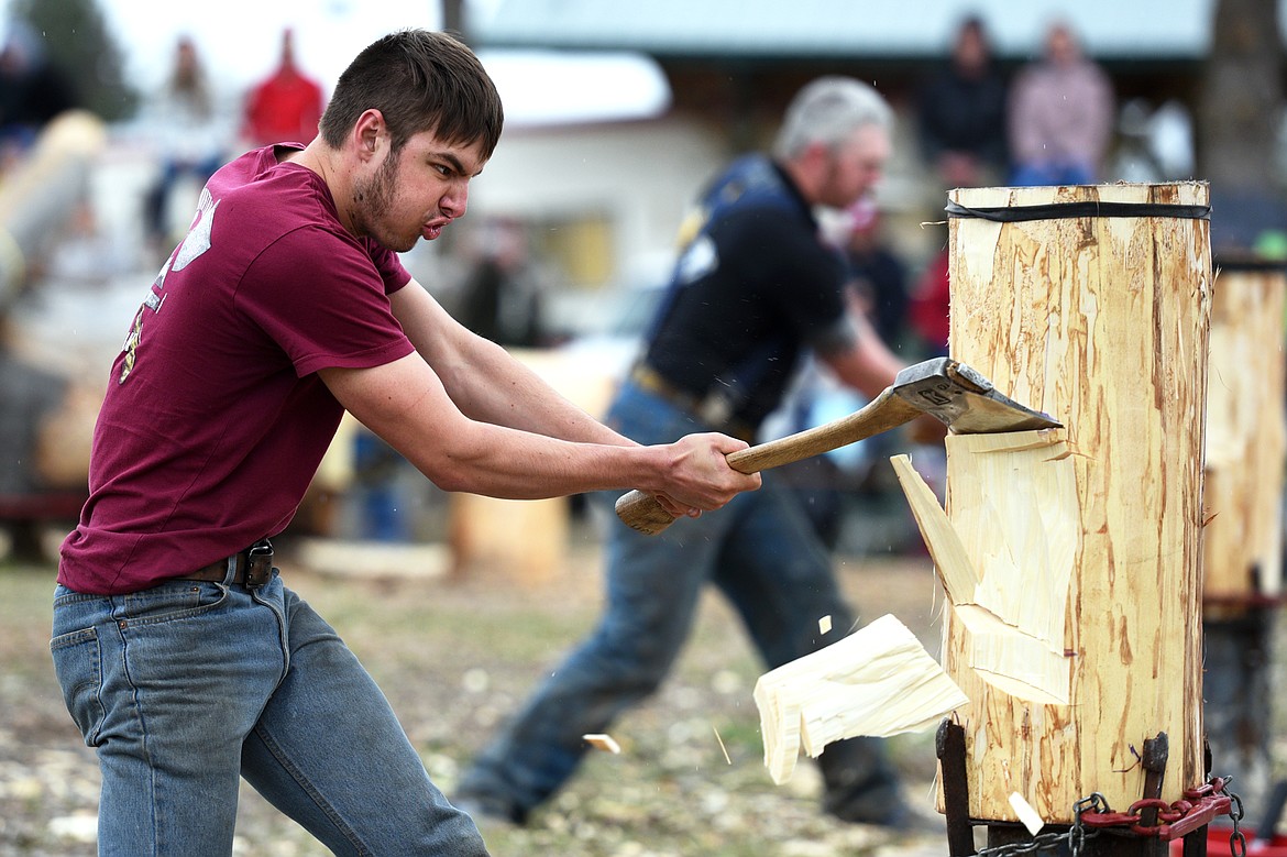 Owen Oster, front, of the University of Montana&#146;s Woodsman Team, competes in the Vertical Hard Hit event during Stumpjumper Days at the FVCC Logger Sports Arena on Saturday. In the background is University of Idaho&#146;s Kris Cunio. (Casey Kreider/Daily Inter Lake)