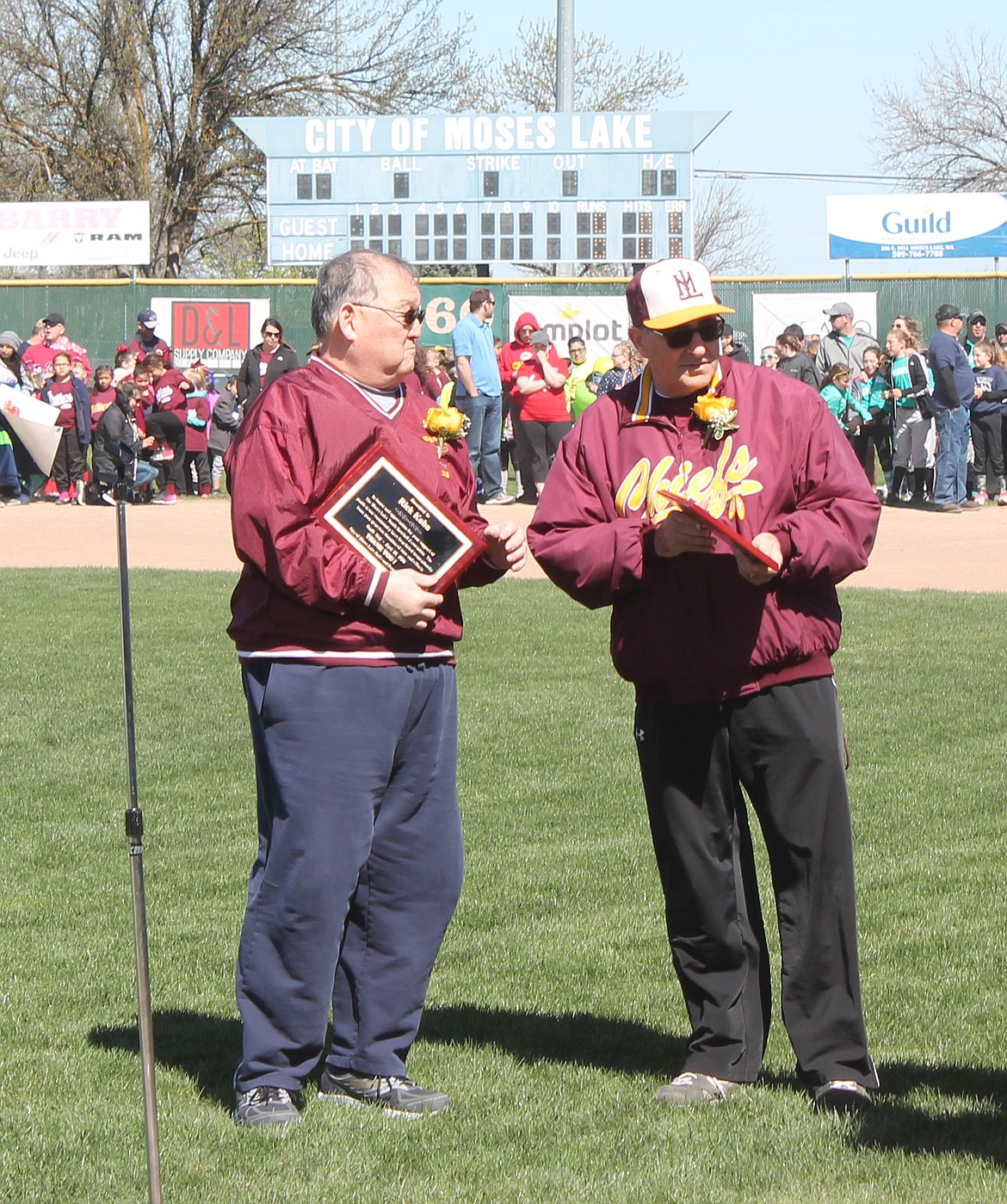 Joel Martin/Columbia Basin Herald
Parade grand marshals Rick Koba (left) and Pete Doumit were honored for their decades of service at the Moses Lake youth sports opening day ceremony Saturday.