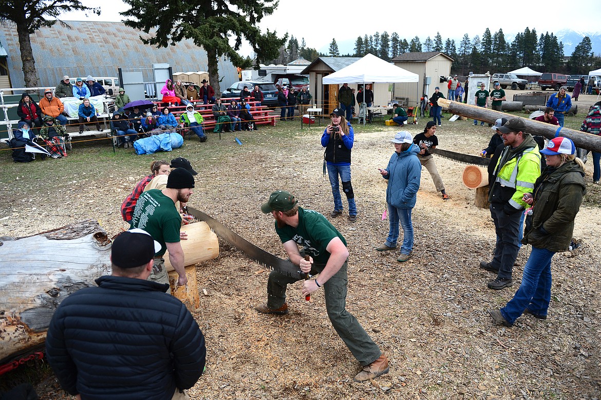 Flathead Valley Community College&#146;s Jim Vincent and Whitney Barr compete in the Jack and Jill Double Buck during Stumpjumper Days at the FVCC Logger Sports Arena on Saturday. Vincent and Barr took second place with a time of 22.74. (Casey Kreider/Daily Inter Lake)