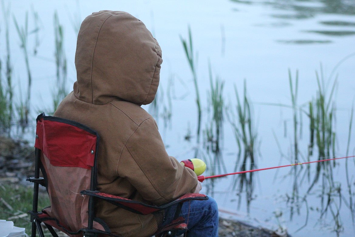 Richard Byrd/Columbia Basin Herald
Fishing equals waiting. Most people who fish know that and the youngsters at Oasis Park Saturday morning got first-hand experience with that fact.