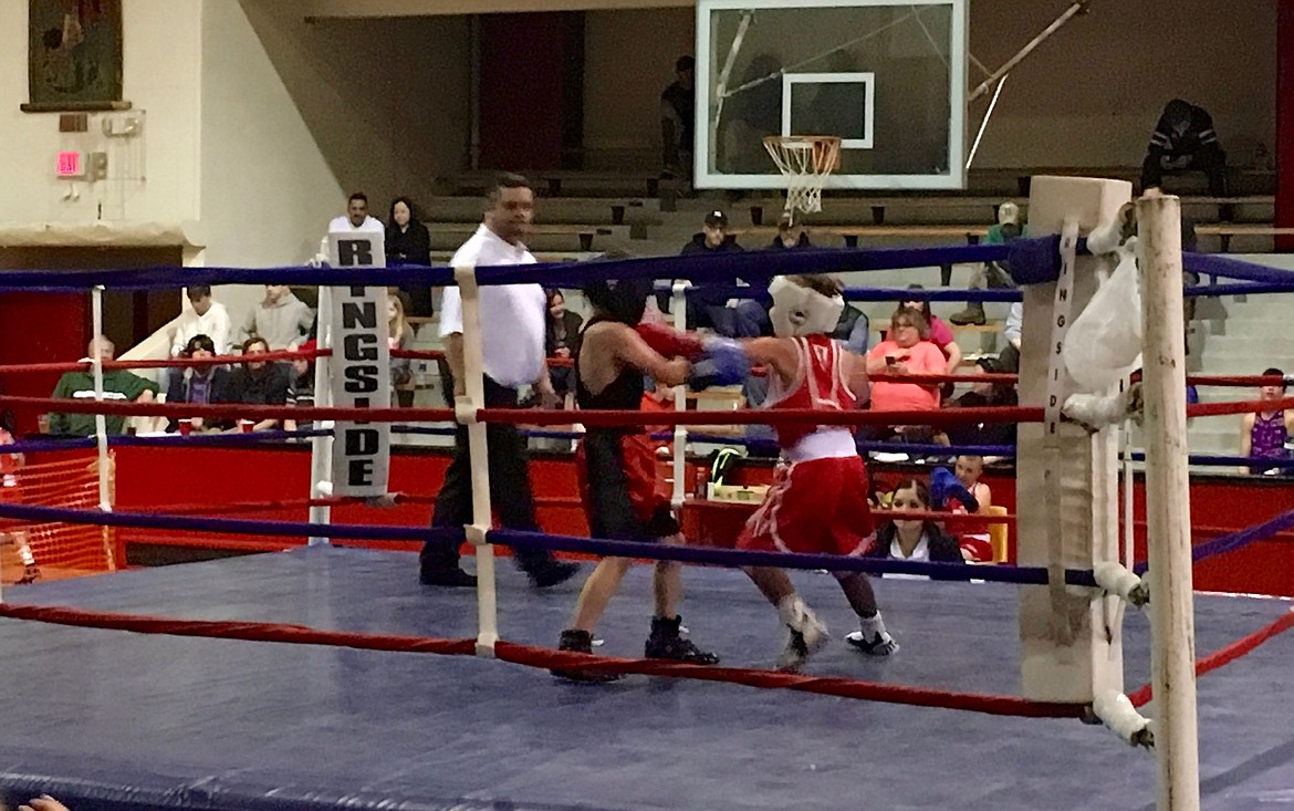 Tyler Wuerful (red) fighting against Casey Chavez (blue) from Treasure Valley.