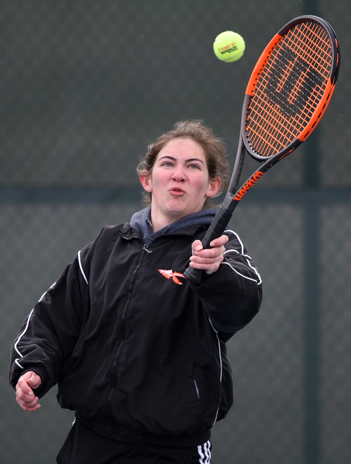 Flathead High School's Cassidy Lavin hits a return against Missoula Sentinel's doubles team of Stella Marquadt and Mehana Benson at Flathead Valley Community College on Saturday. Lavin's doubles teammate was Mikel Twichel. (Casey Kreider/Daily Inter Lake)