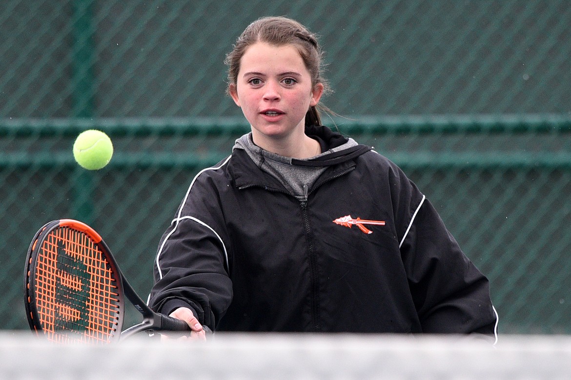 Flathead High School's Mikel Twichel hits a return against Missoula Sentinel's doubles team of Stella Marquadt and Mehana Benson at Flathead Valley Community College on Saturday. Twichel's doubles teammate was Cassidy Lavin. (Casey Kreider/Daily Inter Lake)