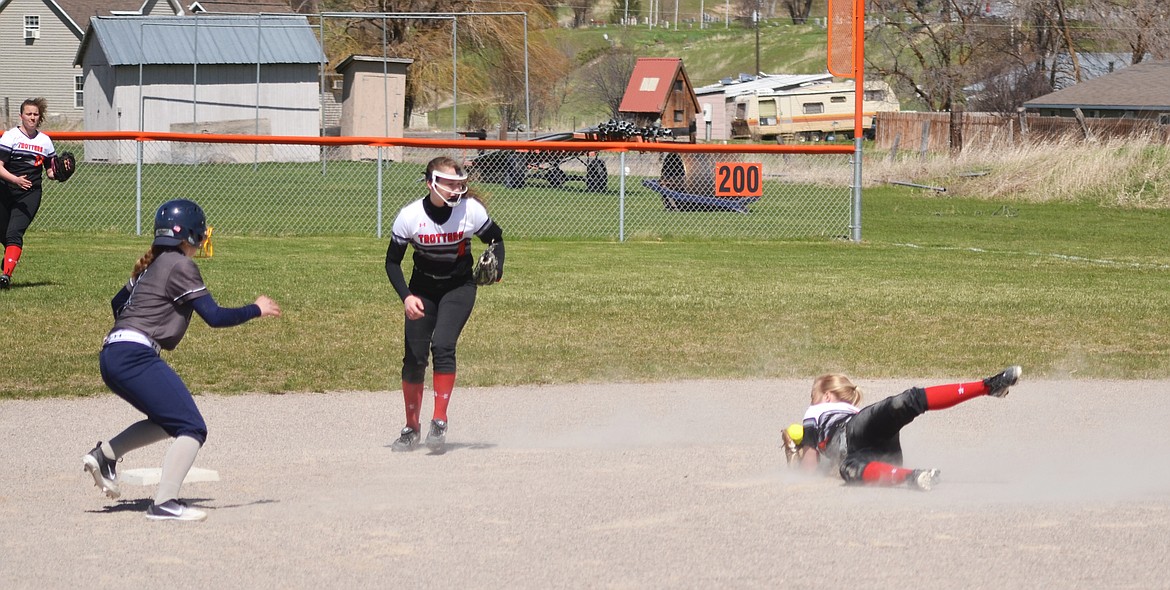 Trotter Stacey Grey makes a dive across the front of second base to catch the line drive, successfully gaining the second out in the second inning for the Trotters (Erin Jusseaume/ Clark Fork Valley Press)