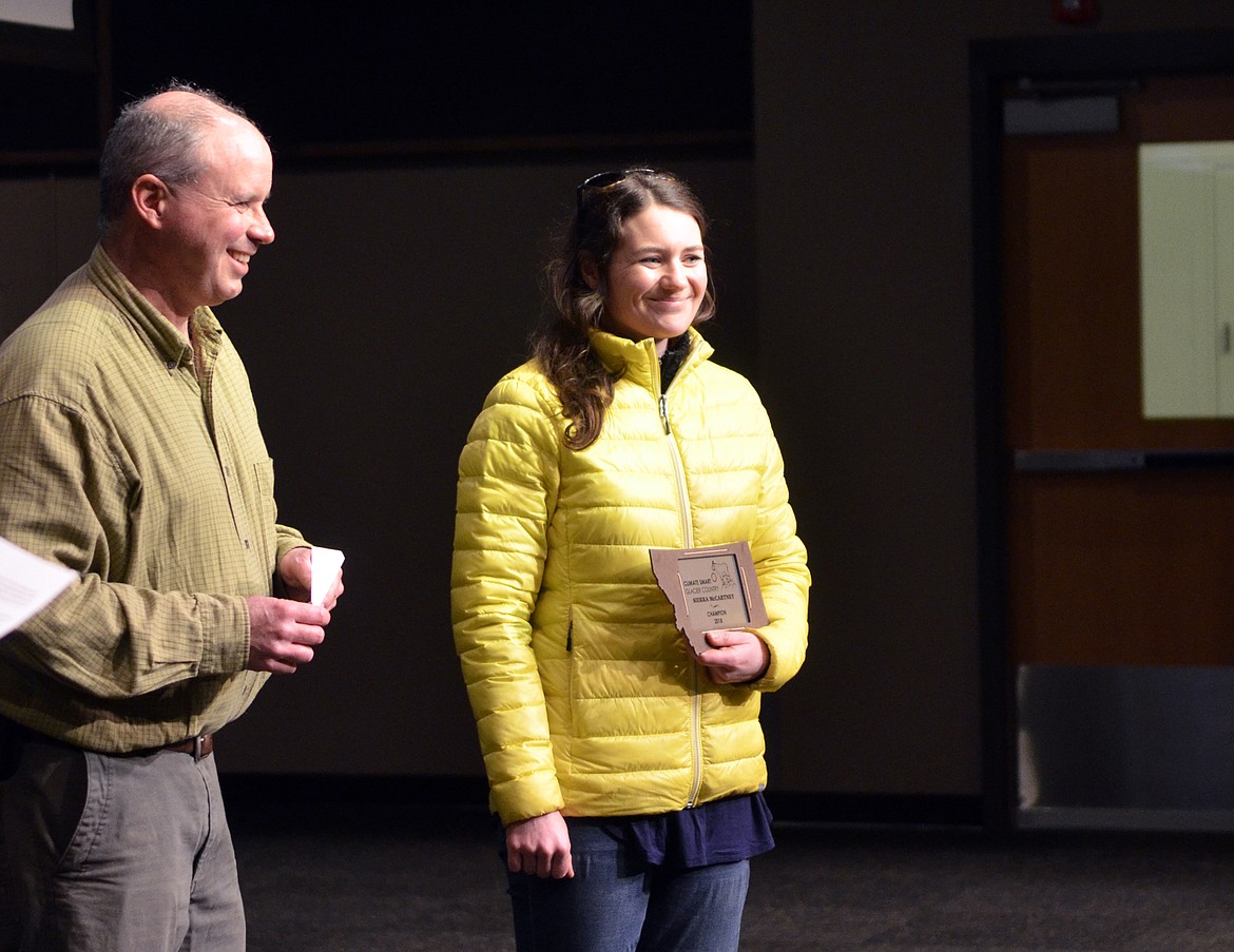 Sierra McCartney as awarded the individual Climate Smart Champion award Saturday for her work on the Climate Action Plan. The awards were presented during the Earth Day celebration at Whitefish High School. Steve Thompson, left, presented her with the award. (Heidi Desch/Whitefish Pilot)