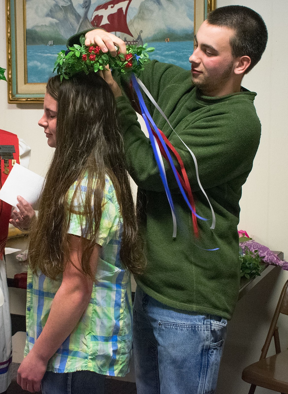 Caleb Thomas, former Nordicfest royalty himself, had a little trouble getting the Nordicfest Princess crown onto his sister, Bethany Thomas, at the annual crowning of the Libby Nordicfest Heritage Festival royalty, April 14. (Ben Kibbey/The Western News)