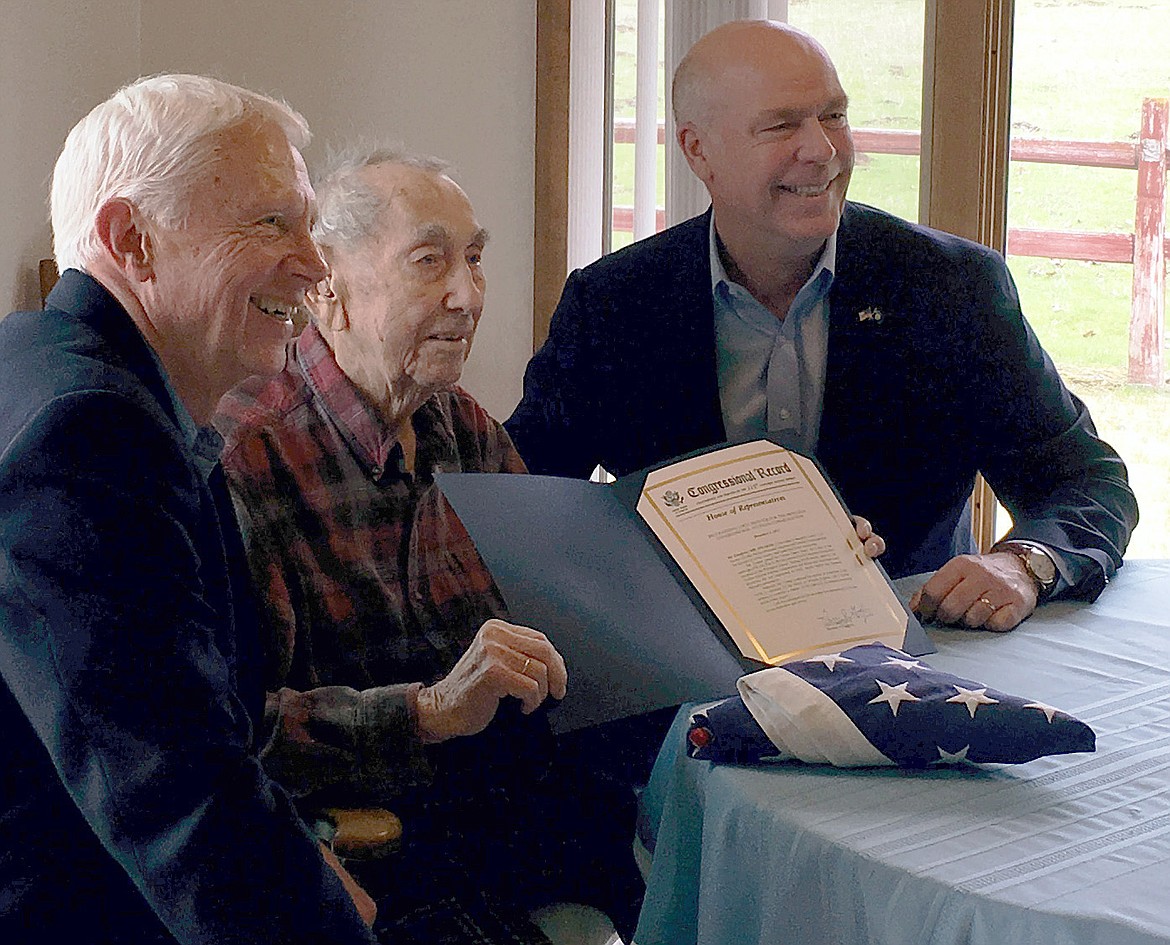 Rep. Jack Bergman of Michigan, left, and Montana Congressman Greg Gianforte, right, pose with Loice “LA” Trotter in his Libby home Saturday, April 14, after presenting Trotter with the Montana Congressional Veteran Commendation and a flag flown over the U.S. Capitol in the veteran’s honor on Veterans Day. Trotter was one of 14 Montana veterans to receive the commendation, a program Gianforte launched last October to recognize Montana veterans who served their country and then served their communities after leaving the military. According to Tom Schultz, the Congressman’s Montana press secretary, Trotter joined the U.S. Army Air Corps at the start of the Second World War and served in the Pacific Theater. During the Japanese invasion of the Philippine Islands, Trotter was captured and held for 40 months. Trotter, who turns 100 this summer, has been a member of the VFW and a volunteer for Meals on Wheels, and has helped on various building projects. Schultz also noted that Bergman is a retired U.S. Marine Corps lieutenant general and a member of the House Committee on Veterans’ Affairs. (Courtesy photo)