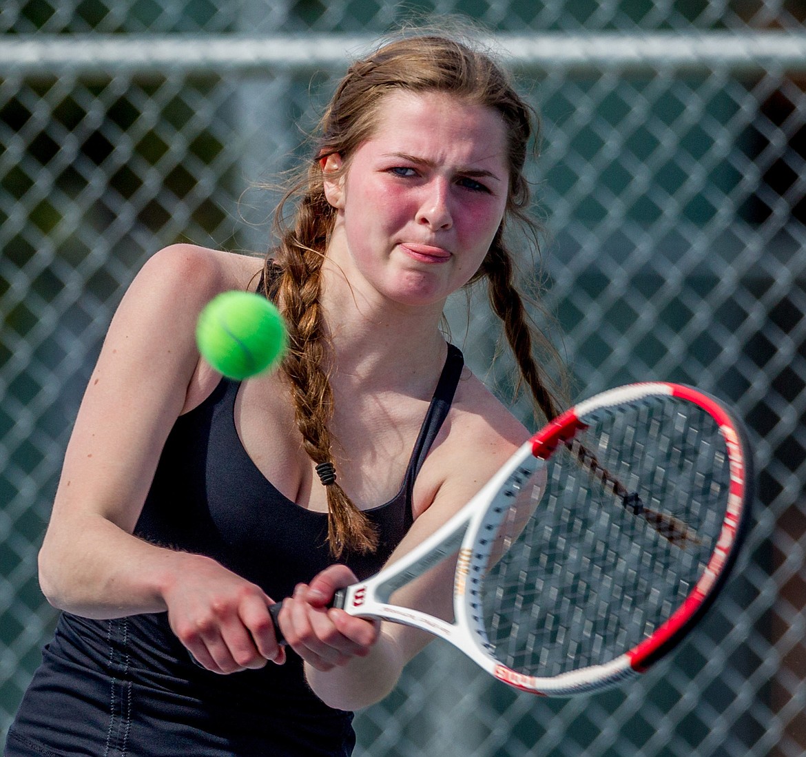 Claire Carloss plays against Libby&#146;s Isabelle Martineau Friday in Libby. (John Blodgett/The Western News)