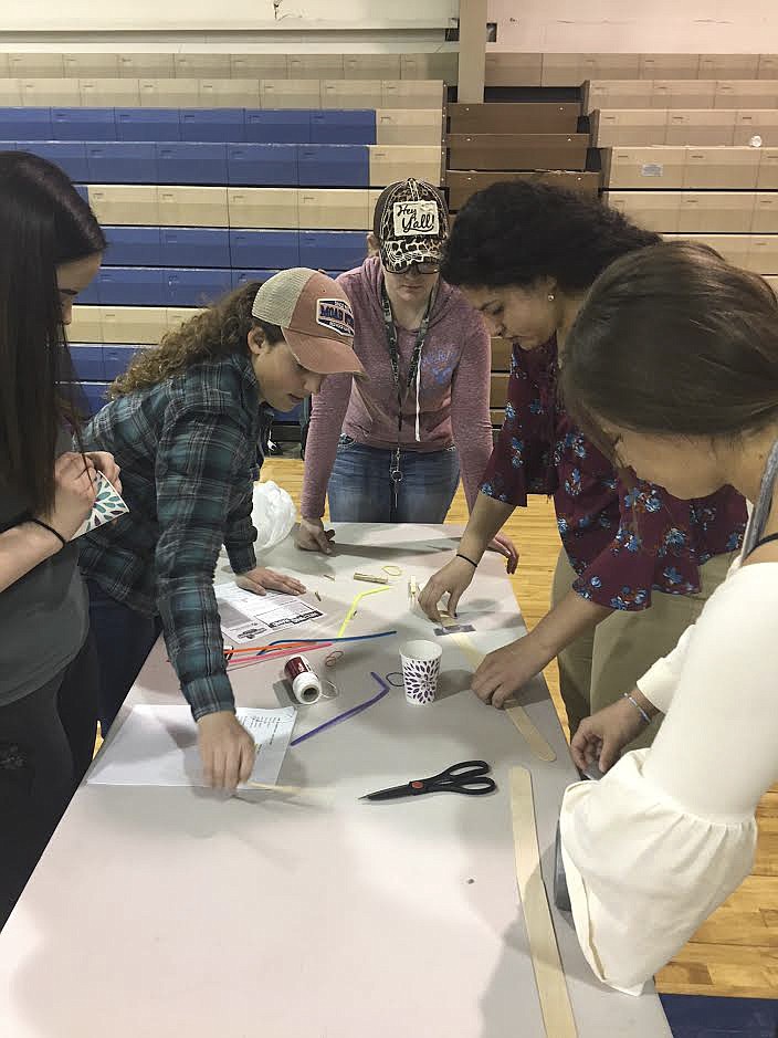 STUDENTS FROM St. Ignatius High School work together during Career Day on Thursday, April 12. (Photo provided)