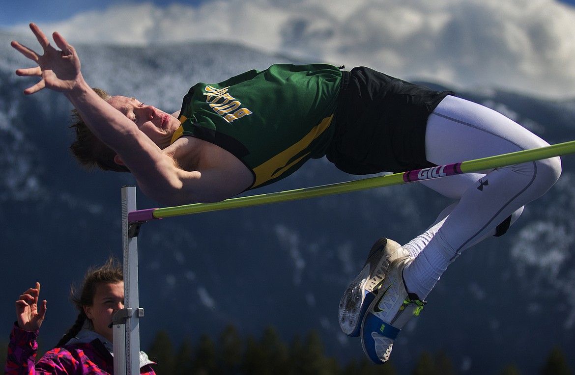 Alex Barker flies over the bar Saturday at Columbia Falls.