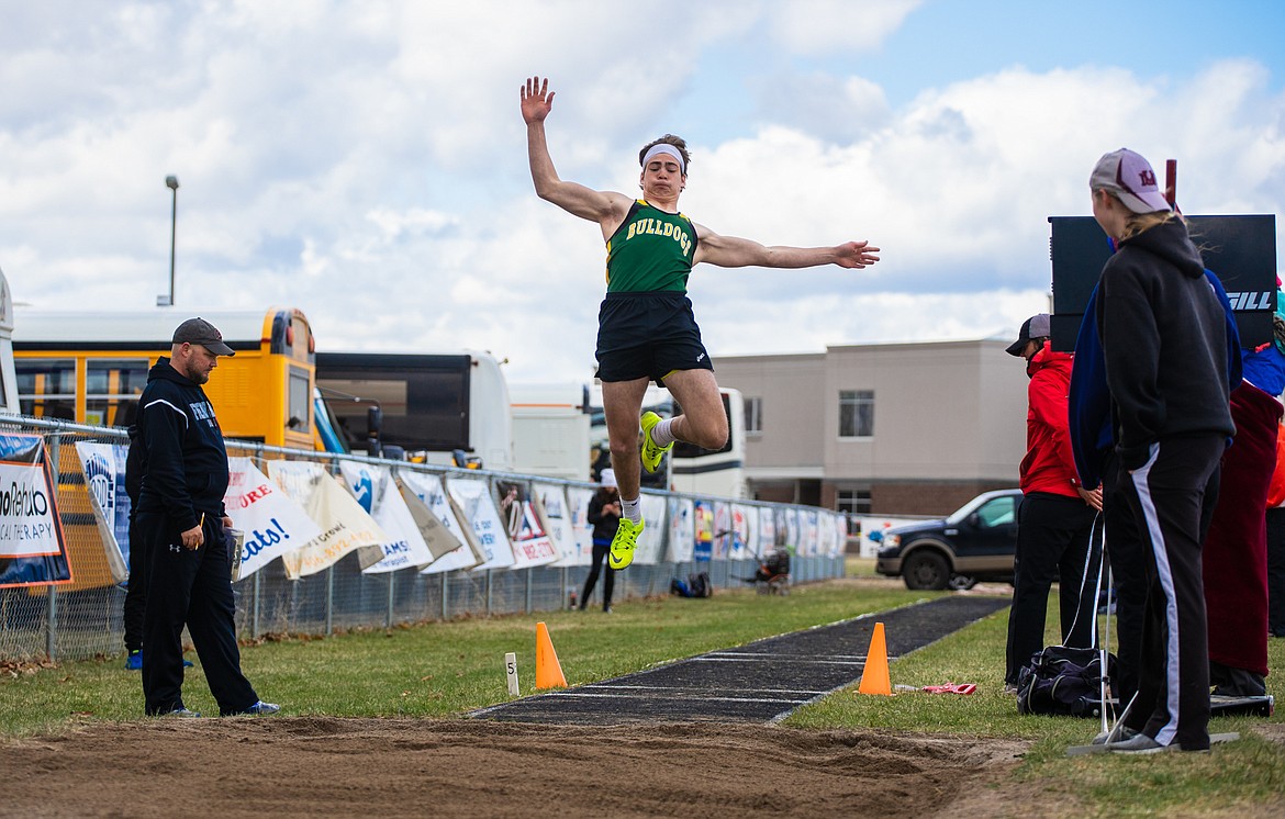 Jack Eisenbarth flies through the air in long jump Saturday at the Columbia Falls Invitational.