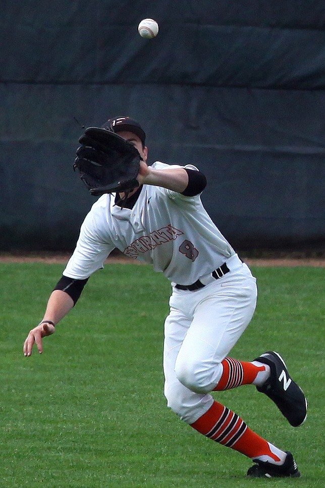 Rodney Harwood/Columbia Basin HeraldEphrata center fielder David Mckeehan makes a running catch during the first game of Saturday's CWAC doubleheader with Quincy.