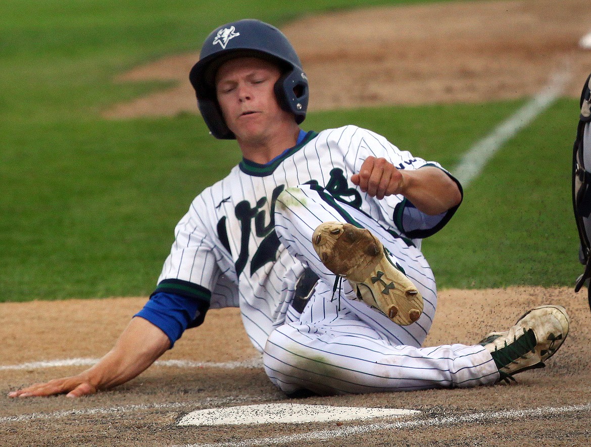 Rodney Harwood/Columbia Basin HeraldBig Bend's Daulton Kvenvold slides in to score the Vikings only run in the NWAC East opener with Spokane on Saturday.