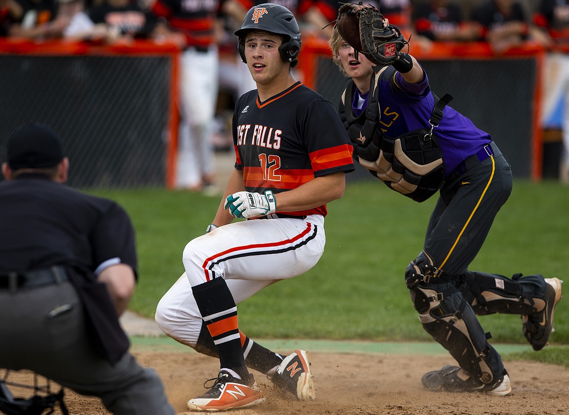 Post Falls baserunner Matt Fleming is tagged out at home plate by Lewiston catcher Braden Ruddell in the second inning of the 5A Region 1 baseball championship game on Tuesday at Post Falls High School.

LOREN BENOIT/Press