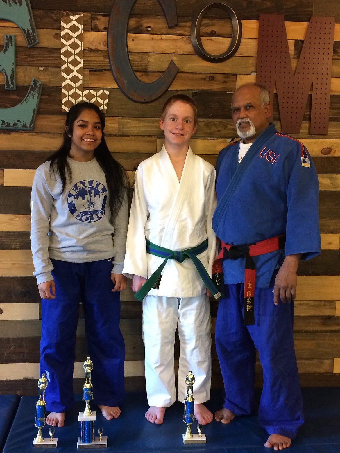 Courtesy photo
Goshinjitsu Martial art school at Forge Fitness in Post Falls competed in Seattle Northwest Judo Championship in Bellevue, Wash., on May 5. Ryan Wood, center, took 2nd place in the boys 11-12 year-old division. Raji Singh, left, took first place in girls 15-16 year-old lightweight division and second place in middleweight division. At right is instructor Bijay Singh.