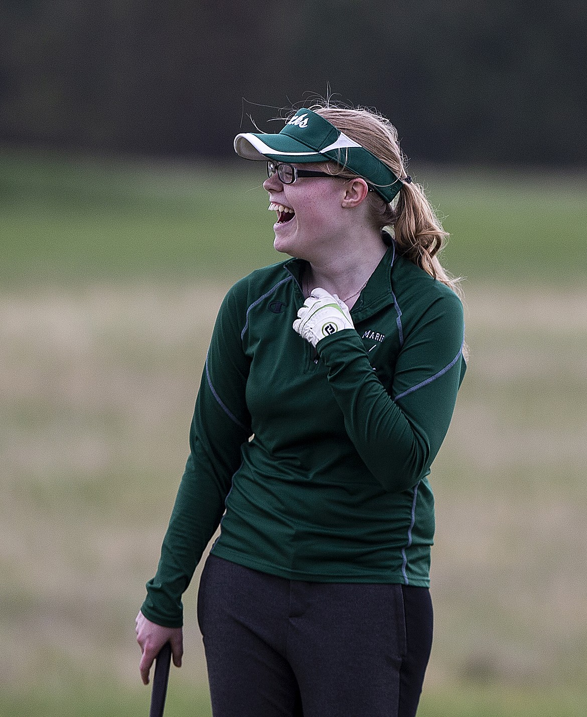 Tabitha Boller of St. Maries smiles after making a long putt on hole one Monday morning at the 2A District 1 tournament at The Links Golf Club. (LOREN BENOIT/Press)