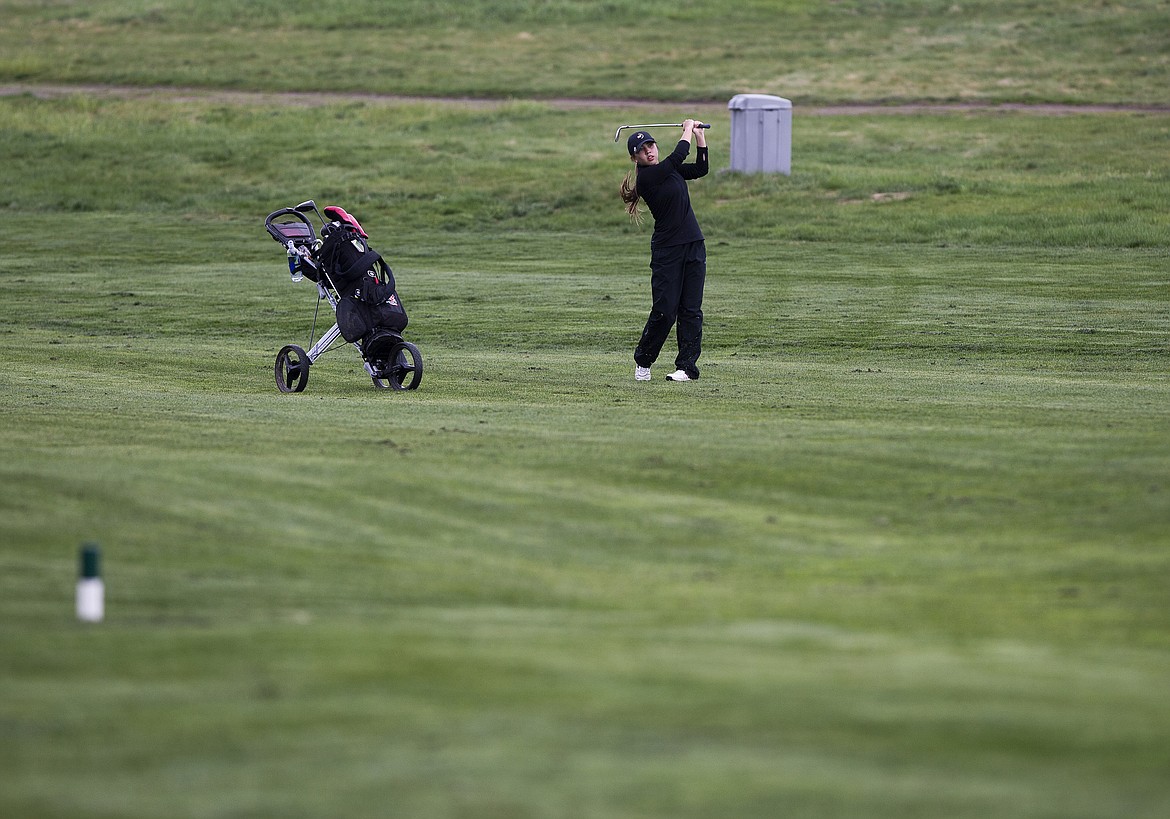 Alyssa SiJohn of Lakeside watches her iron shot fall near the hole one green Monday morning at the 2A District 1 tournament at The Links Golf Club. (LOREN BENOIT/Press)