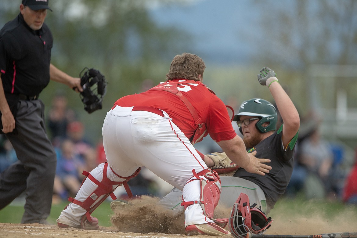 (Photo by JASON DUCHOW PHOTOGRAPHY)
Lakeland&#146;s Braden Gifford is tagged out at home plate by Sandpoint catcher Hunter Donahoe in the Hawks&#146; 3-1 win in the opener of the best-of-three 4A Region 1 tournament on Monday.