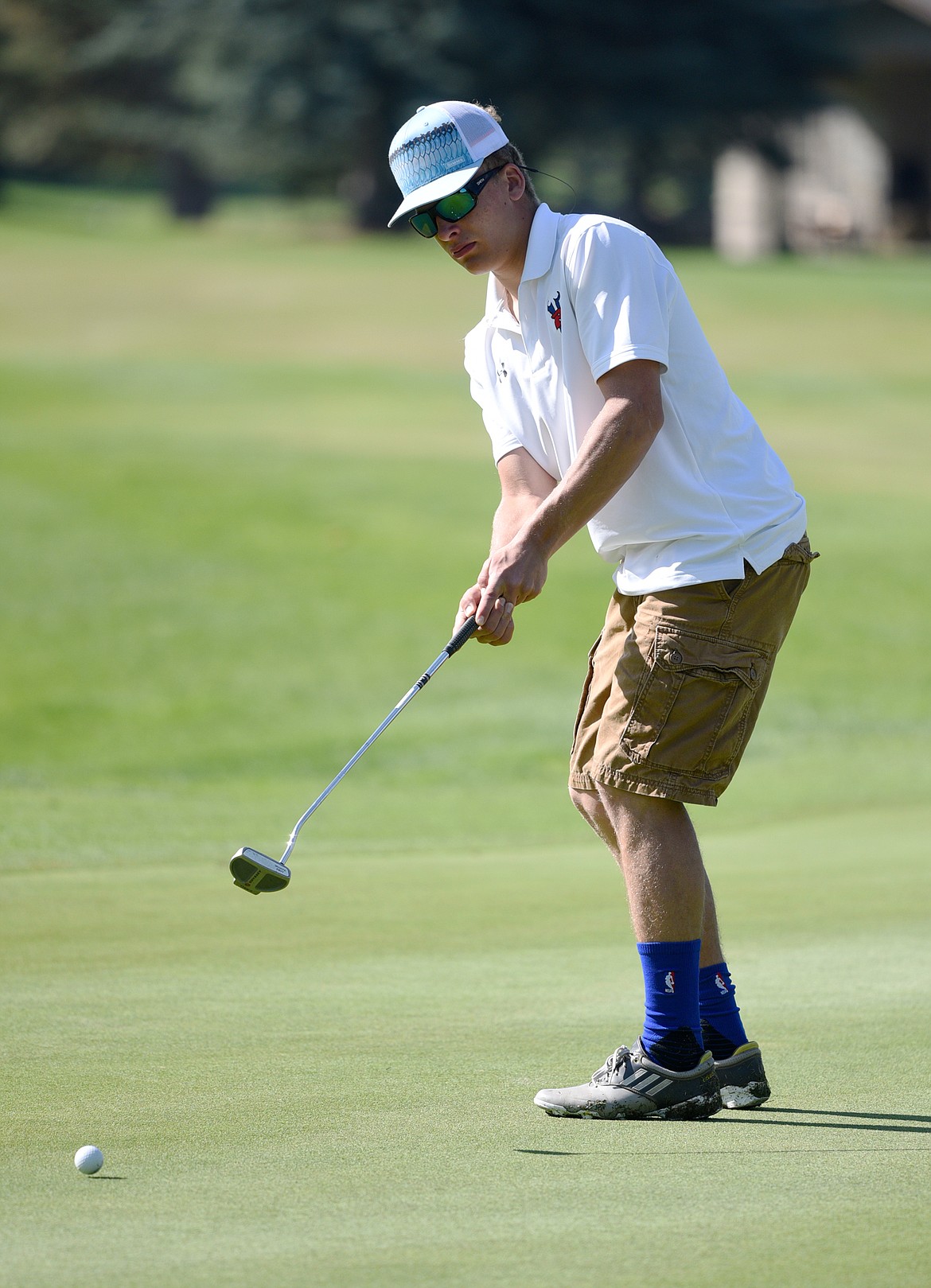 Bigfork&#146;s Jimmy Abney putts on the 11th green at Eagle Bend Golf Club on Tuesday. (Casey Kreider/Daily Inter Lake)