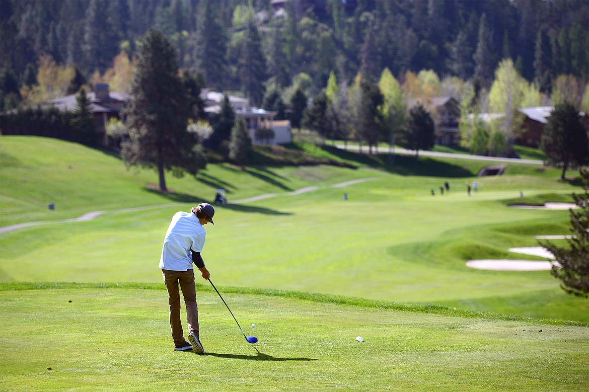 Bigfork&#146;s Asher VanCampen tees off on the 13th hole at Eagle Bend Golf Club on Tuesday. (Casey Kreider/Daily Inter Lake)