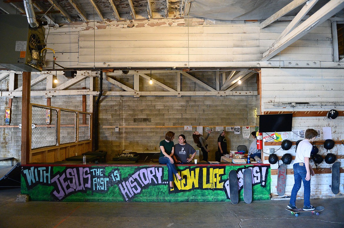 Community Pastor Miriam Mauritzen (center left) and Kerri Fromm (center right) a volunteer and board member, supervise an open skate at Serious JuJu at 707 W. Center St. in Kalispell on Friday, May 4. (Casey Kreider/Daily Inter Lake)