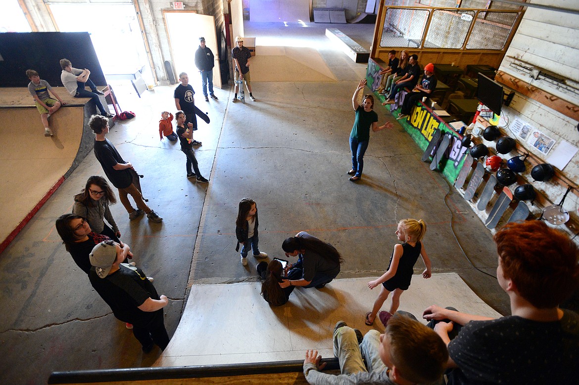 Community Pastor Miriam Mauritzen (center right) gathers skaters to go over announcements during an open skate at Serious JuJu at 707 W. Center St. in Kalispell on Friday, May 4. (Casey Kreider/Daily Inter Lake)