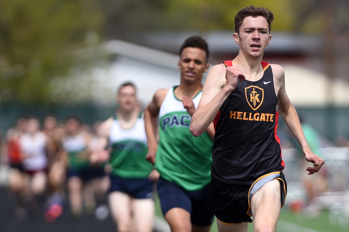 Missoula Hellgate's Will Dauenhauer takes first in the boys 800-meter run ahead of Glacier's Elijah Boyd and Joseph VandenBos at the Archie Roe track and field meet at Legends Stadium on Saturday. (Casey Kreider/Daily Inter Lake)