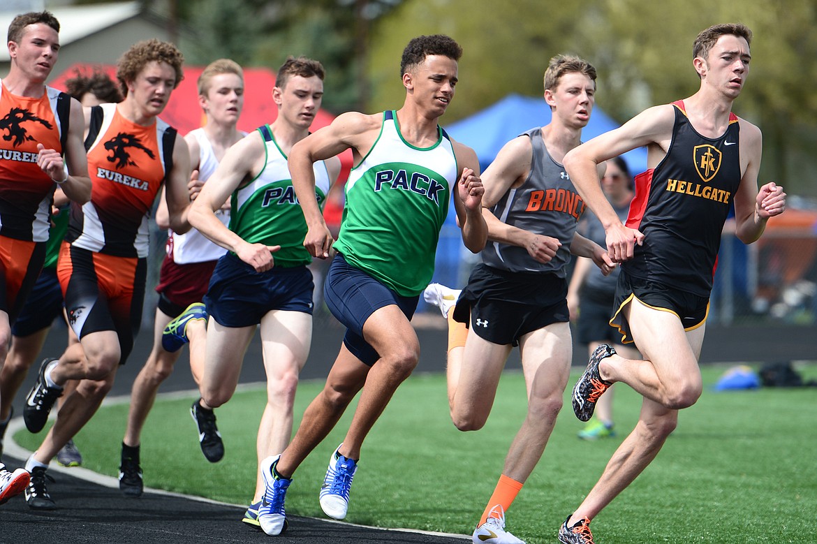 Missoula Hellgate's Will Dauenhauer leads Glacier's Elijah Boyd, center, and Joseph VandenBos, left, in the boys 800-meter run at the Archie Roe track and field meet at Legends Stadium on Saturday. (Casey Kreider/Daily Inter Lake)