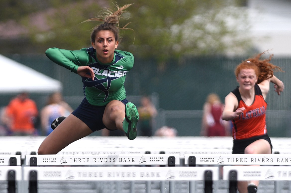 Glacier's Faith Brennan wins her heat in the girls 100-meter hurdles at the Archie Roe track and field meet at Legends Stadium on Saturday. (Casey Kreider/Daily Inter Lake)