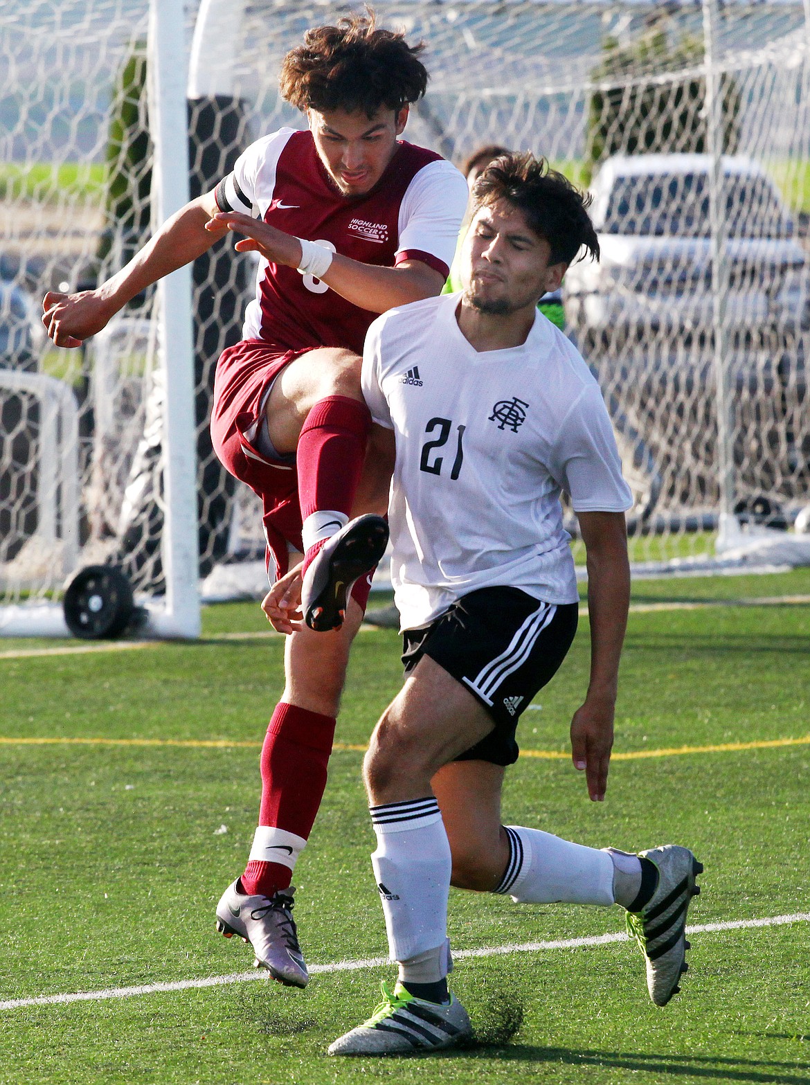 Rodney Harwood/Columbia Basin Herald
Royal striker Uriel Garcia (21) closes on Highland defender Carlos Lopez (8) as he clears a ball in the Scotties' defensive end in the first half of Tuesday's 1A District 5 second-round match at David Nielsen Stadium.