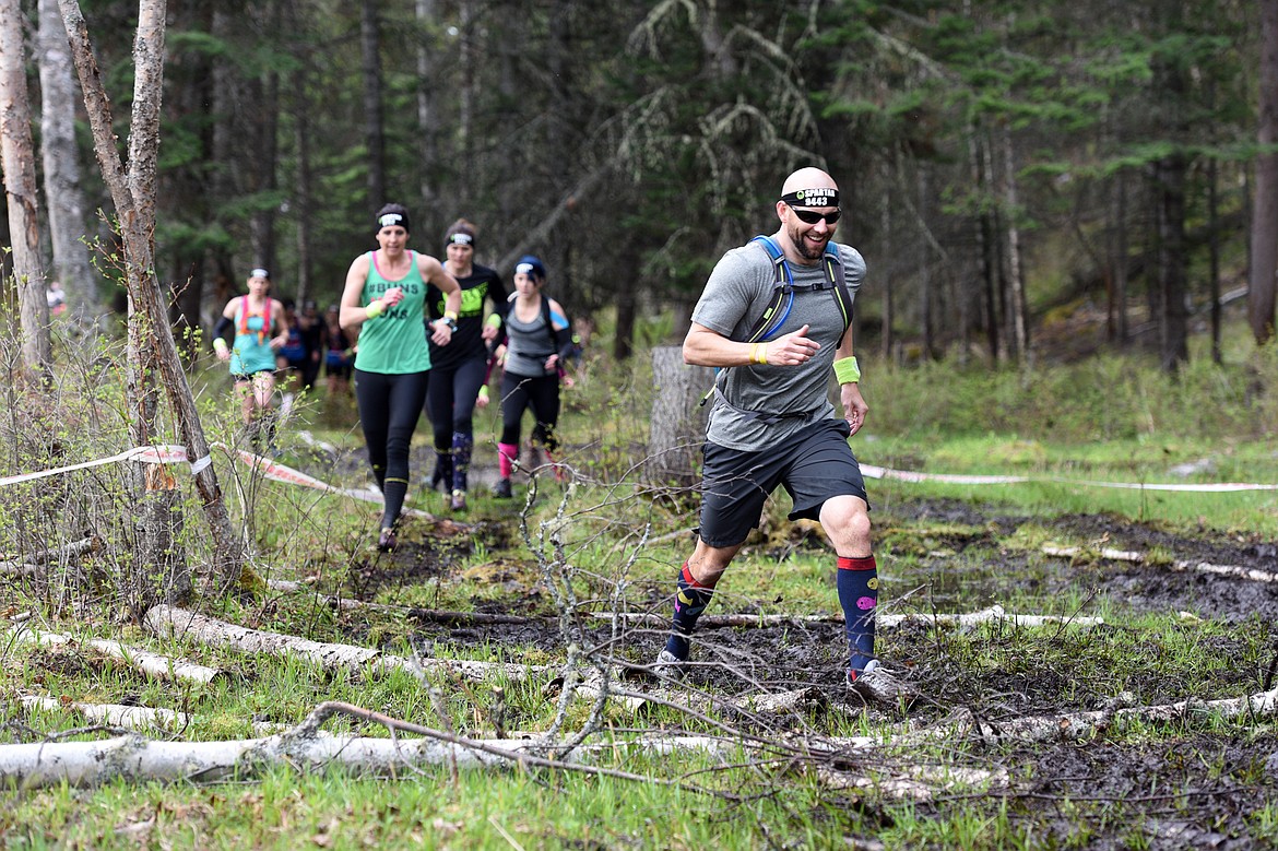 Competitors navigate the 13-mile &#147;Beast&#148; course at Spartan&#146;s Mountain Series Race in Bigfork on Saturday. (Casey Kreider/Daily Inter Lake)