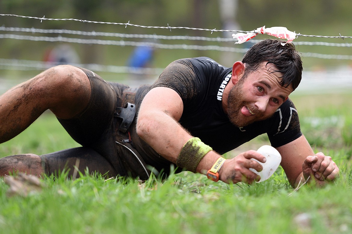 A competitor navigates a barbed wire section of the &#147;Beast&#148; course. 
(Casey Kreider/Daily Inter Lake)