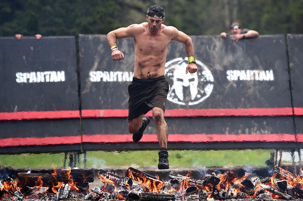 Competitors cross the finish line after completing the 13-mile &#147;Beast&#148; course at Spartan&#146;s Mountain Series Race in Bigfork on Saturday. (Casey Kreider/Daily Inter Lake)