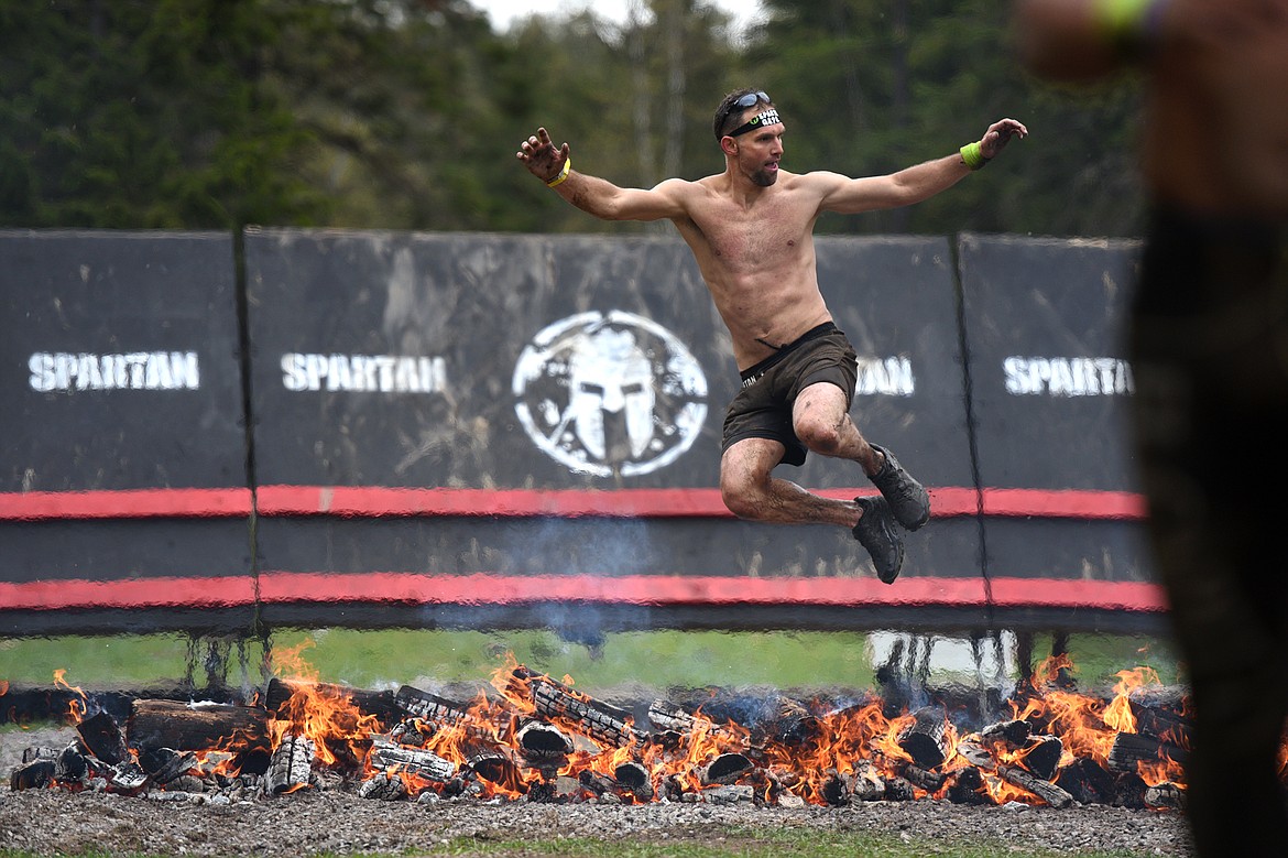 Competitors cross the finish line after completing the 13-mile &#147;Beast&#148; course at Spartan&#146;s Mountain Series Race in Bigfork on Saturday. (Casey Kreider/Daily Inter Lake)