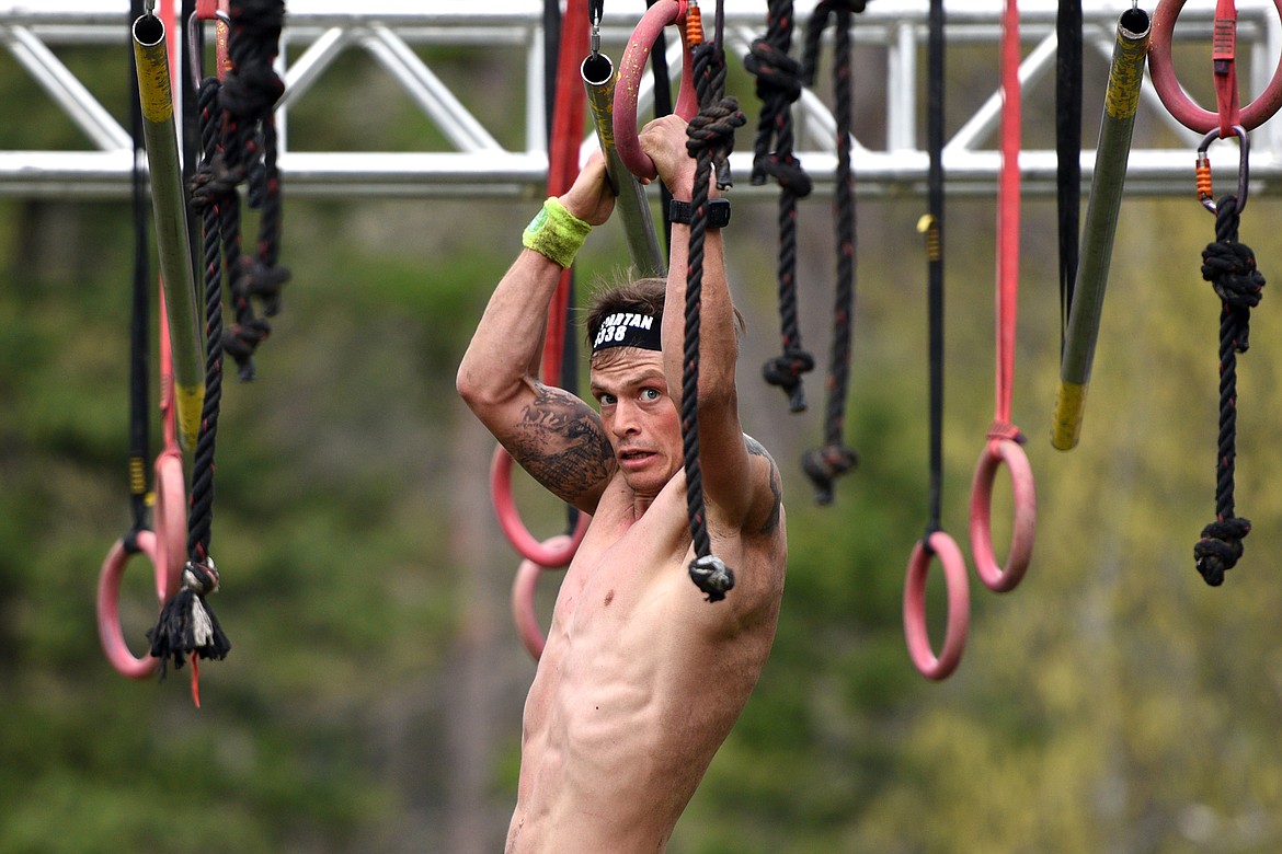 A competitor takes on an obstacle along the 13-mile Spartan Race course. 
(Casey Kreider/Daily Inter Lake)