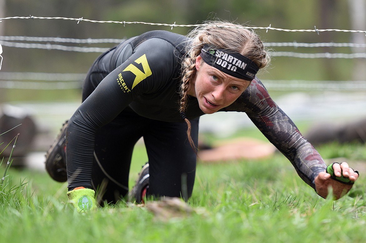 A competitor navigates a barbed wire section of the &#147;Beast&#148; course.
 (Casey Kreider/Daily Inter Lake)