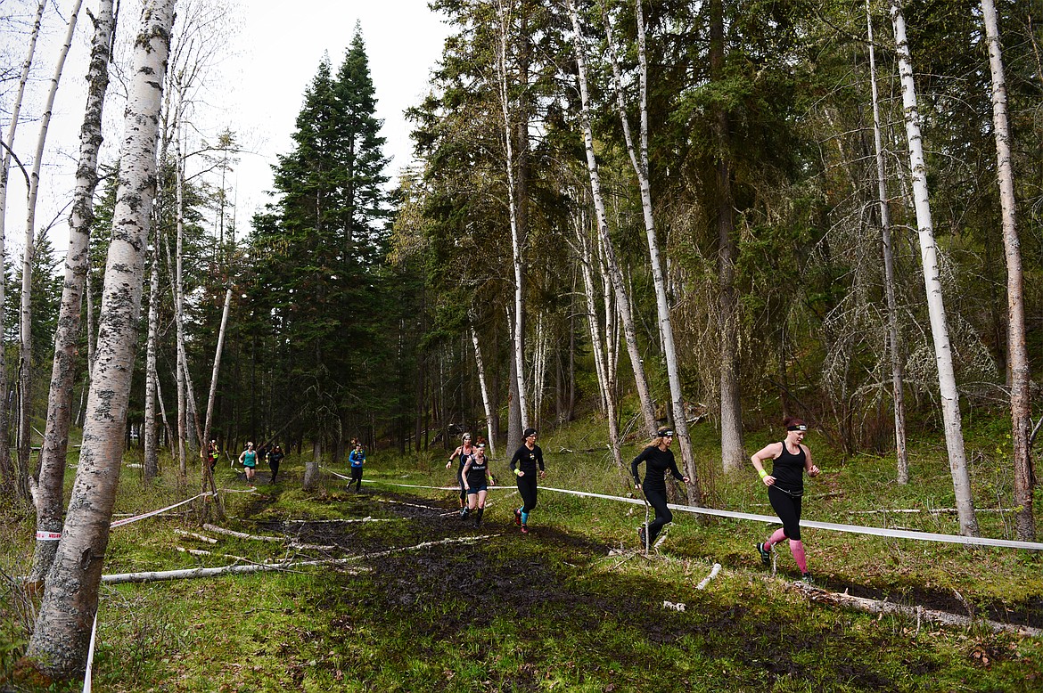 Competitors run between obstacles at the Spartan&#146;s Mountain Series Race in Bigfork on Saturday.
 (Casey Kreider/Daily Inter Lake)