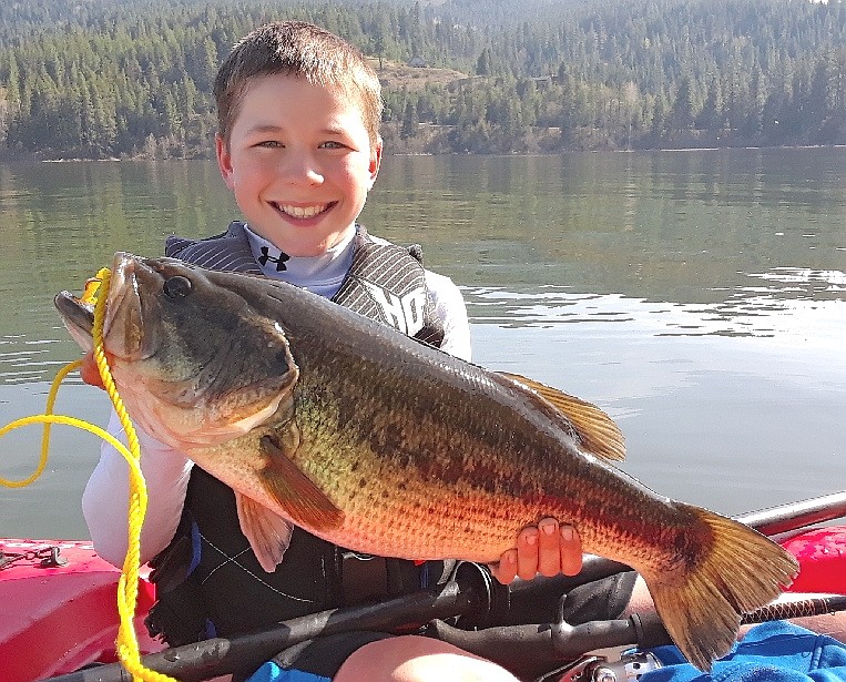 Ridley Foil, 11, with the 7-pound Lake Coeur d&#146;Alene largemouth, he kept, ate and had mounted. The brothers usually catch and release all of their fish, they said.