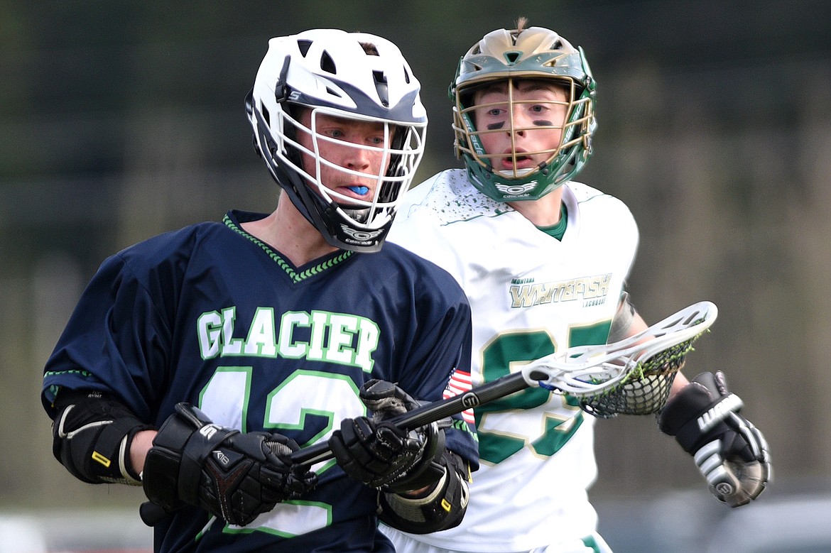 Glacier&#146;s Lincoln Jones readies a shot that would find the back of the net with Whitefish&#146;s Riley Gulick trailing on Thursday. (Casey Kreider/Daily Inter Lake)