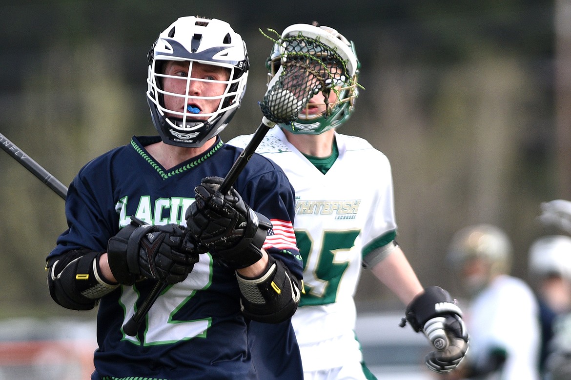 Glacier&#146;s Lincoln Jones readies a shot on goal that would find the back of the net with Whitefish&#146;s Riley Gulick trailing on Thursday. (Casey Kreider/Daily Inter Lake)