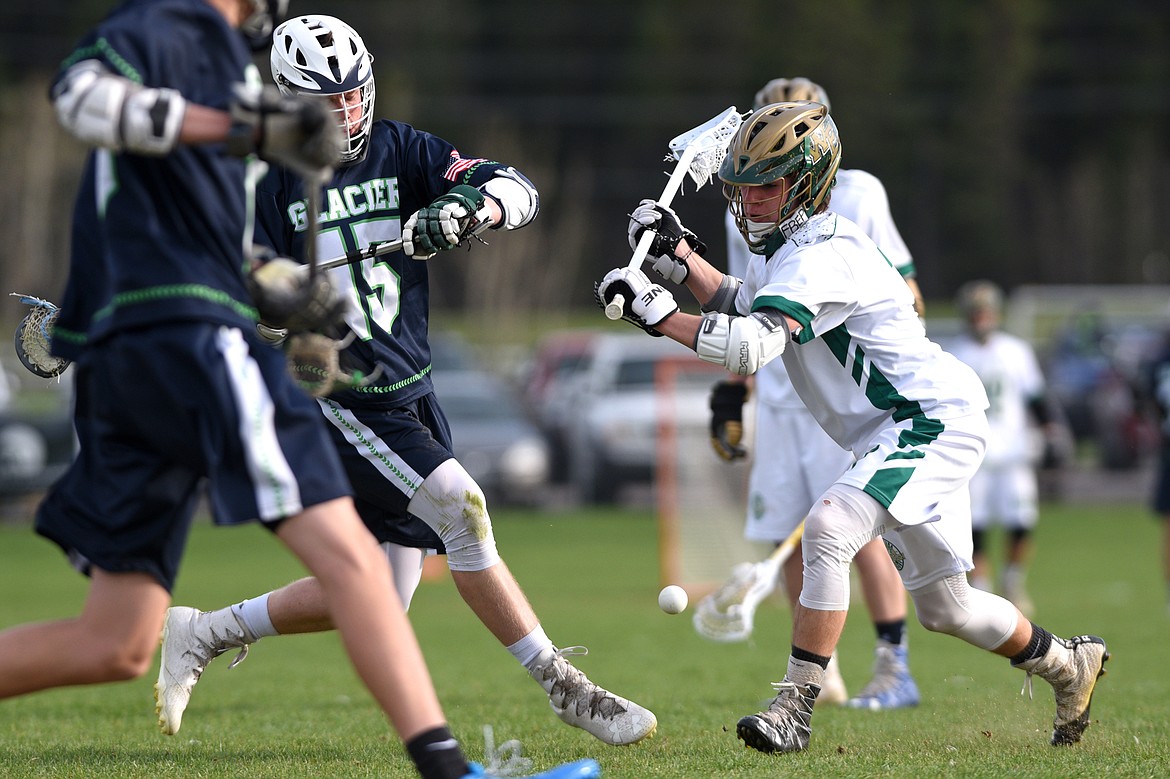 Glacier&#146;s Darin Engellant (15) and Whitefish&#146;s Zach Cote (21) battle for possesion on Thursday. (Casey Kreider/Daily Inter Lake)