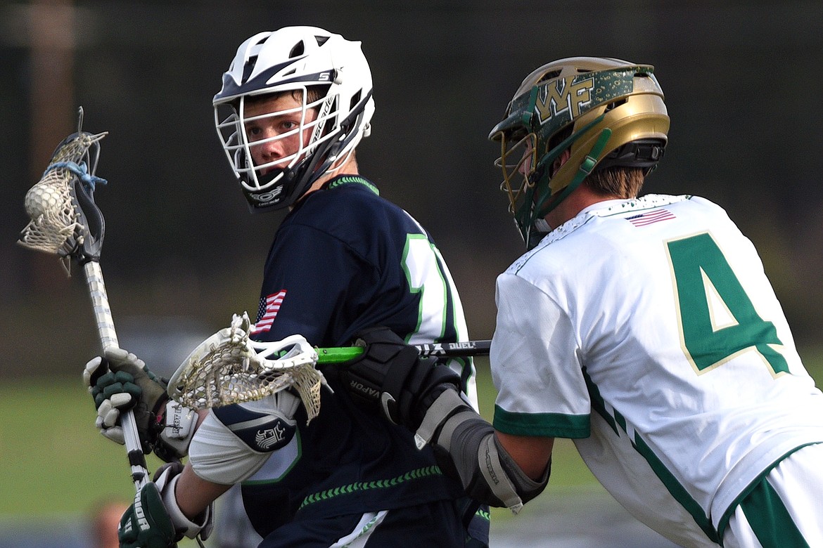 Glacier&#146;s Darin Engellant (15) works against the defense of Whitefish&#146;s Lucas Coulter (4) on Thursday. (Casey Kreider/Daily Inter Lake)